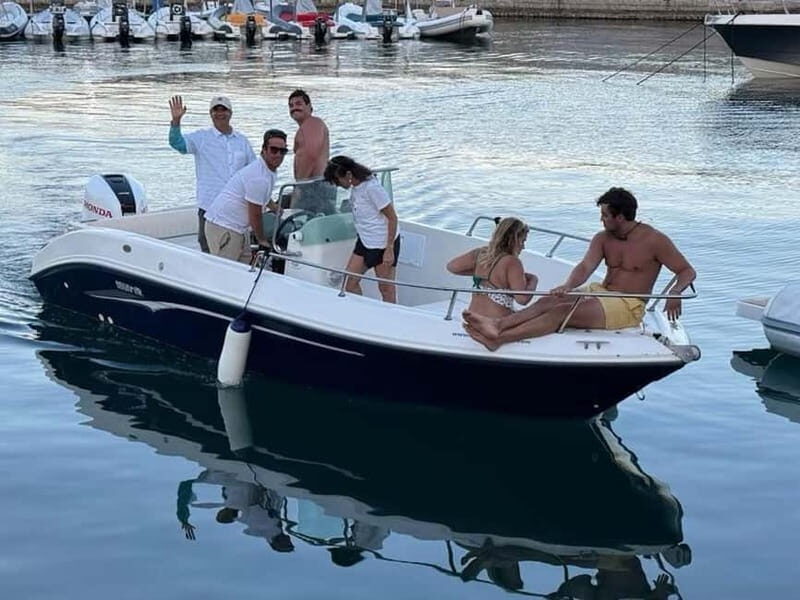Aperitif on a boat at sunset at the Queen Cave - Marina Arenella meeting point: quick, practical, and easy to find